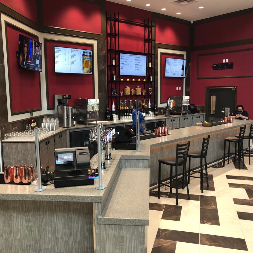 The new theater features a bar serving cocktails, beer and wine.