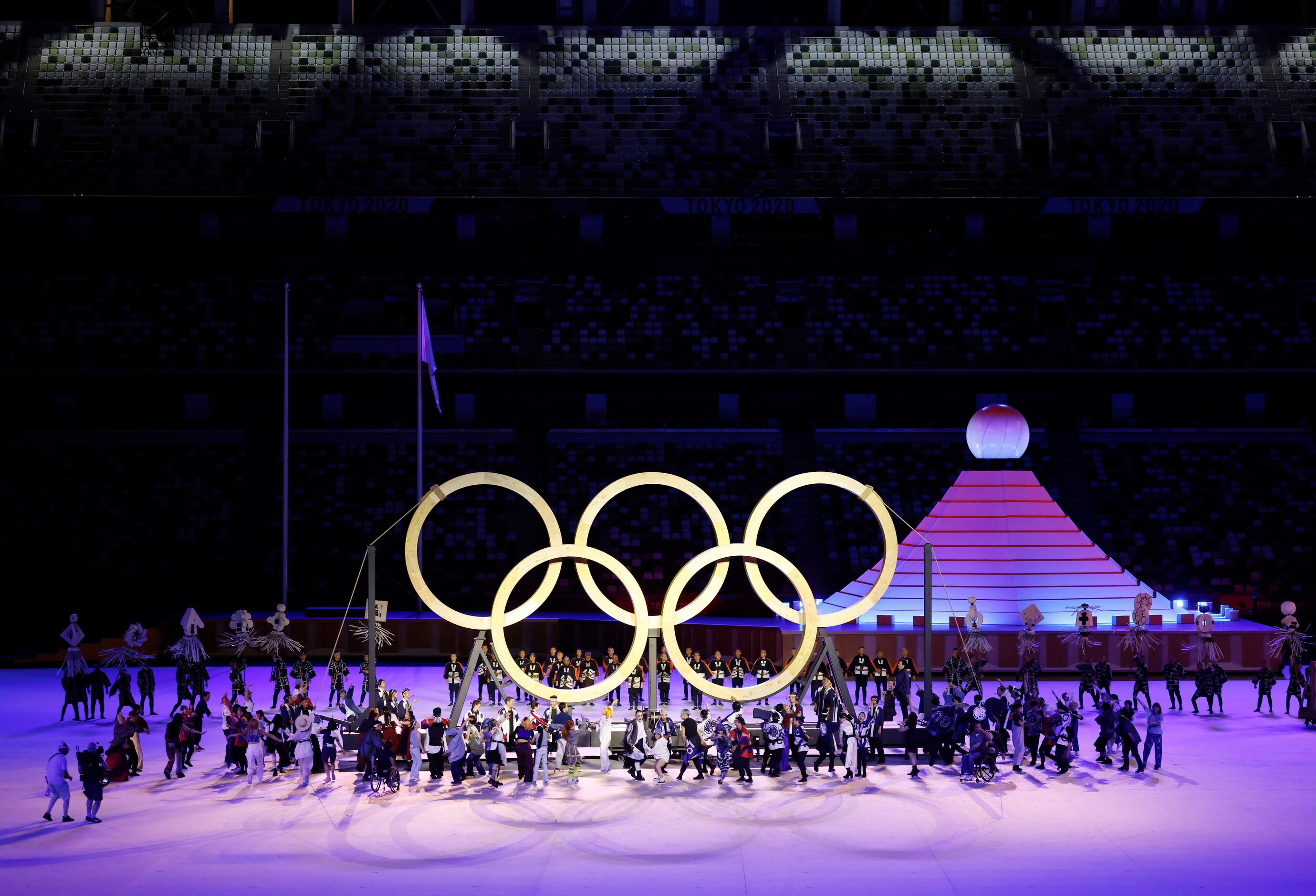 Entertainers perform during the opening ceremony for the postponed 2020 Tokyo Olympics at...