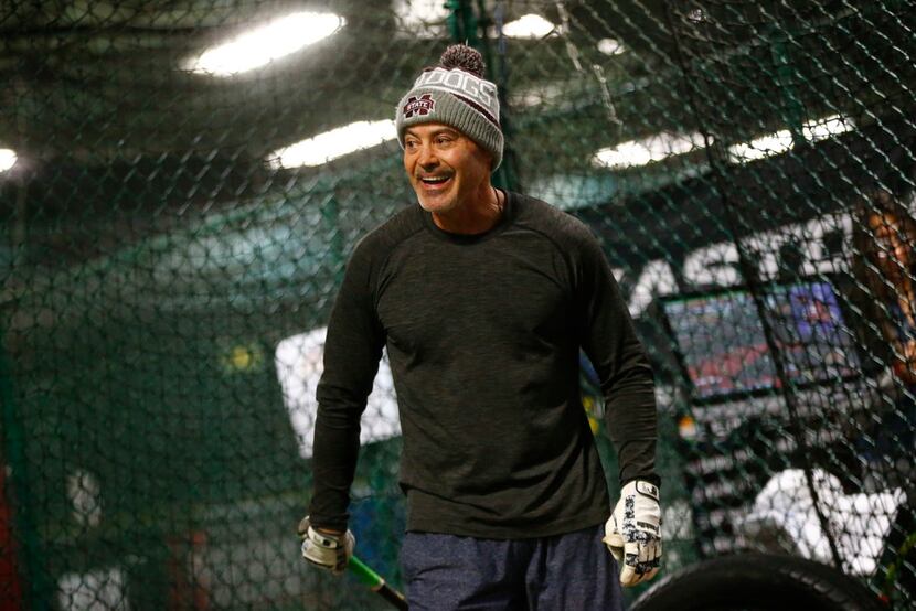 Former Texas Ranger Rafael Palmeiro laughs during batting practice at D-BAT DFW batting cage...