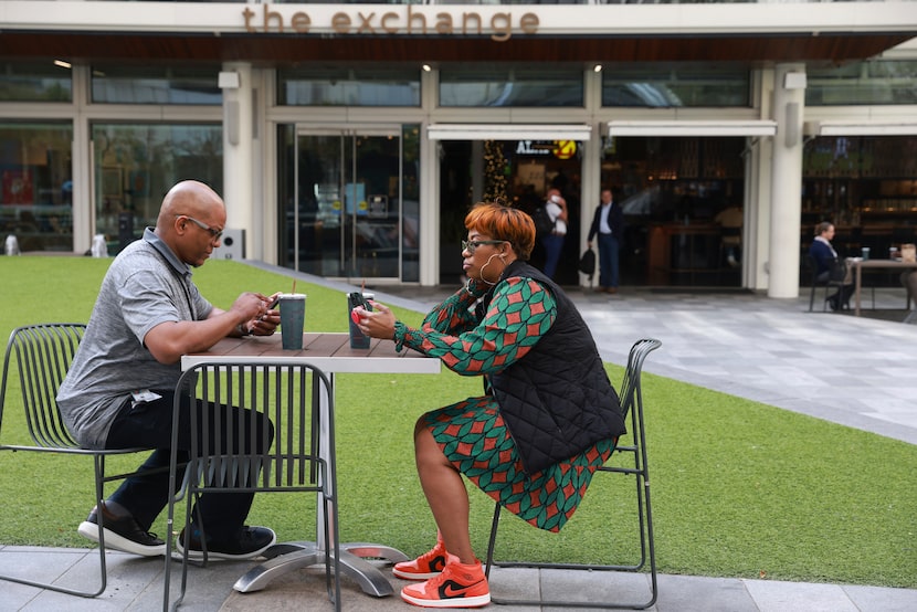 Joe English and Allison Crandle sit at tables during their lunch break at the AT&T Discovery...