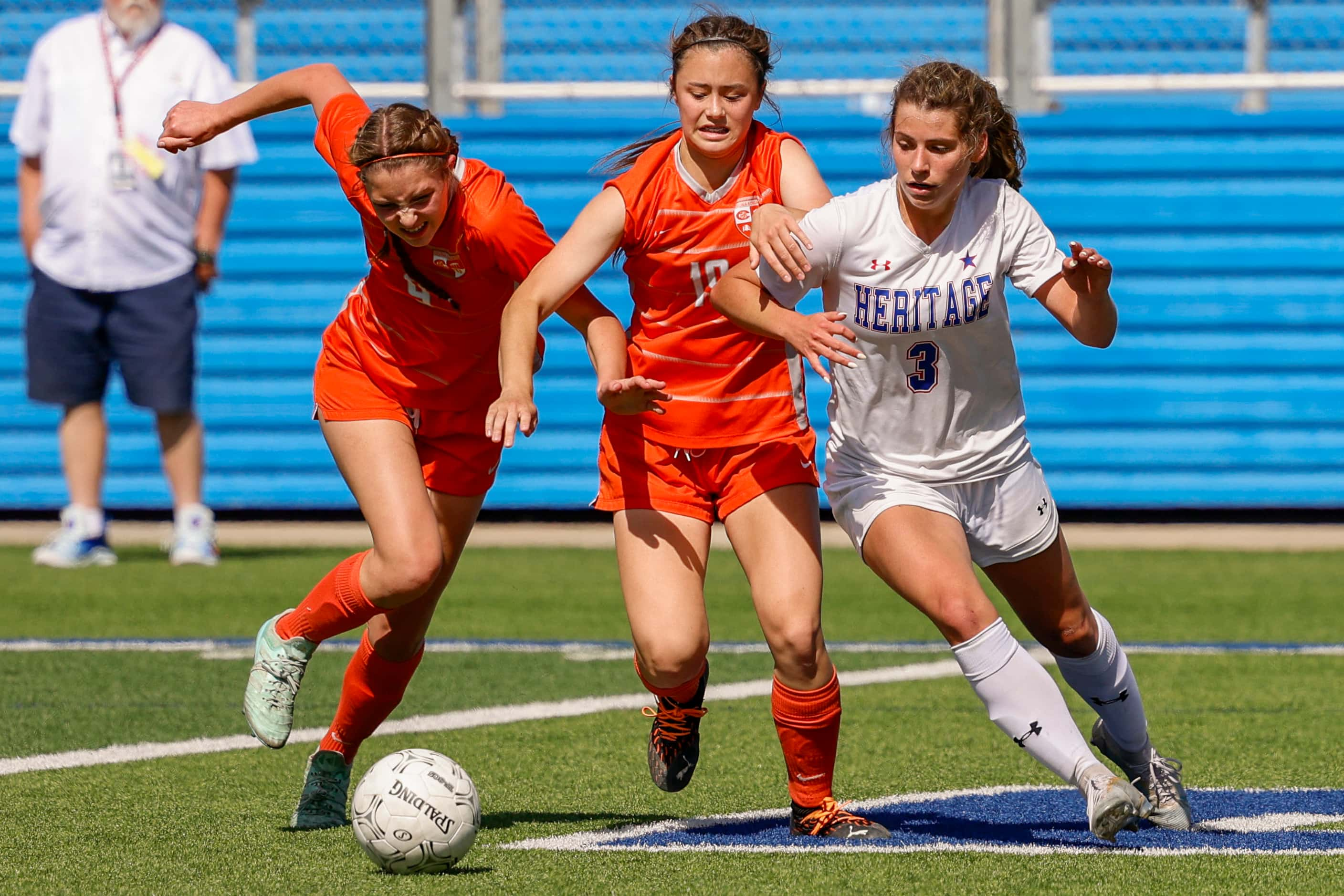 Celina defender Makenna Brantley (4), Celina defender Ashland Stewart (19) and Midlothian...