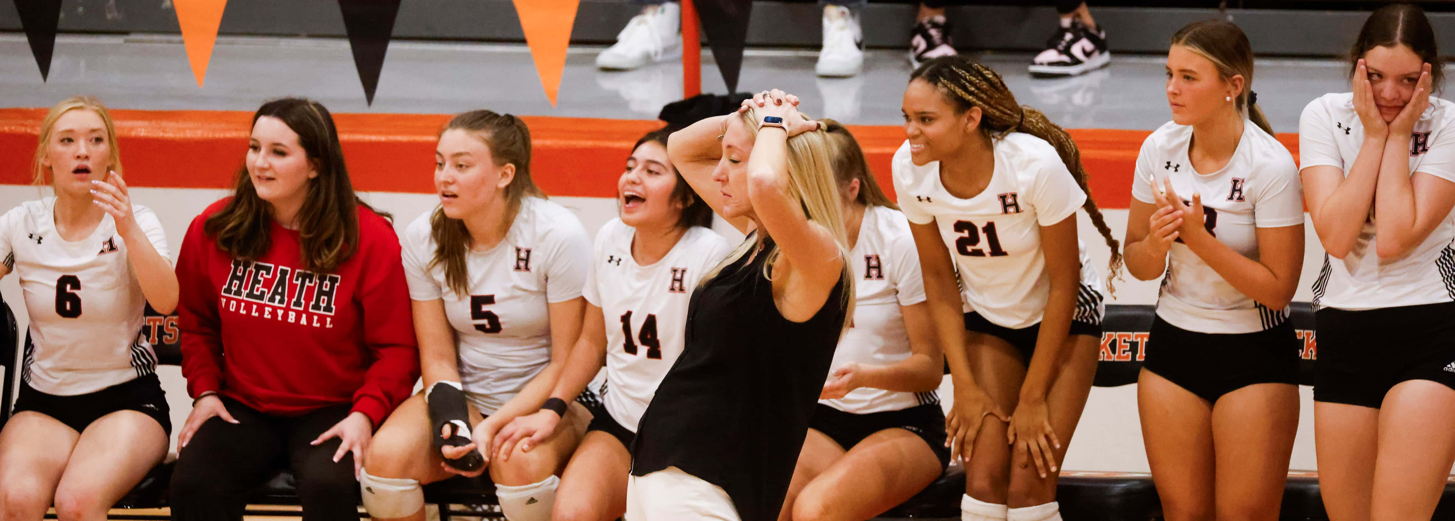 Rockwall Heath’s head coach Maggie Younger alongside bench player reacts after missing a...