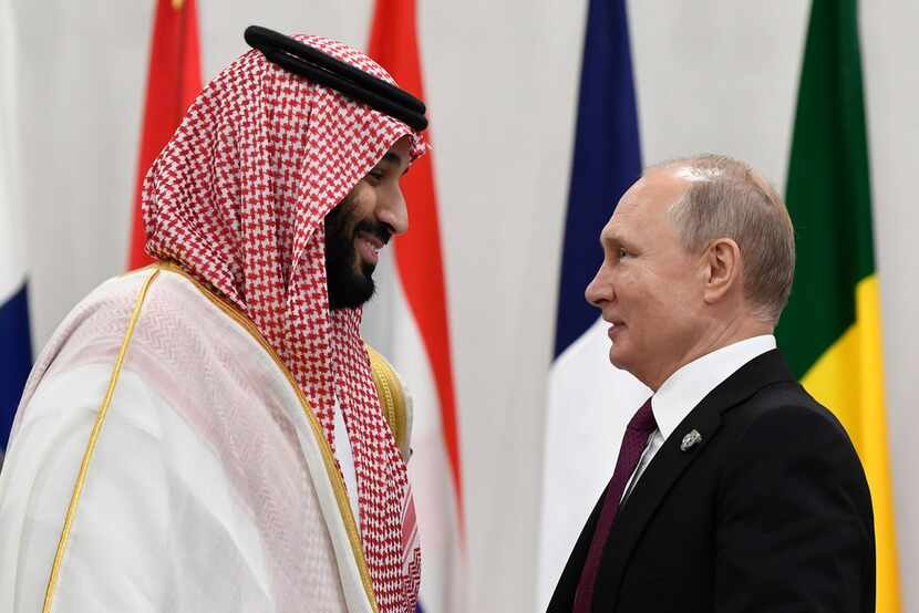 Saudi Arabia's crown prince, Mohammed bin Salman (left), talked with Russian President...