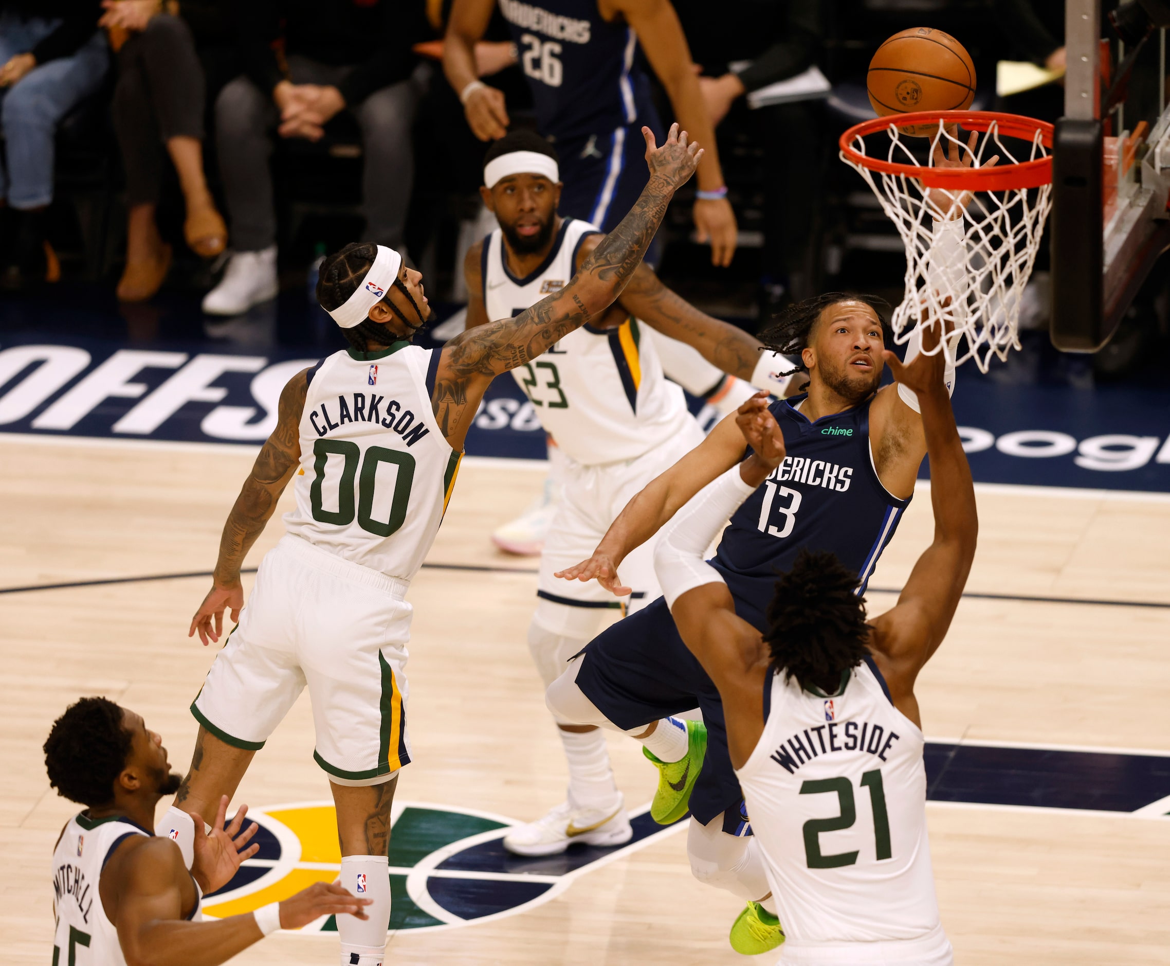 Dallas Mavericks guard Jalen Brunson (13) attempts a shot in between Utah Jazz guard Jordan...