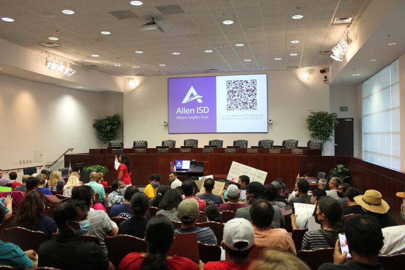 A couple of hundred parents, mostly masked, showed up to the Allen ISD board meeting to...