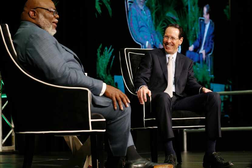 Bishop T.D. Jakes (left) and AT&T Chairman and CEO Randall Stephenson share a laugh as they...