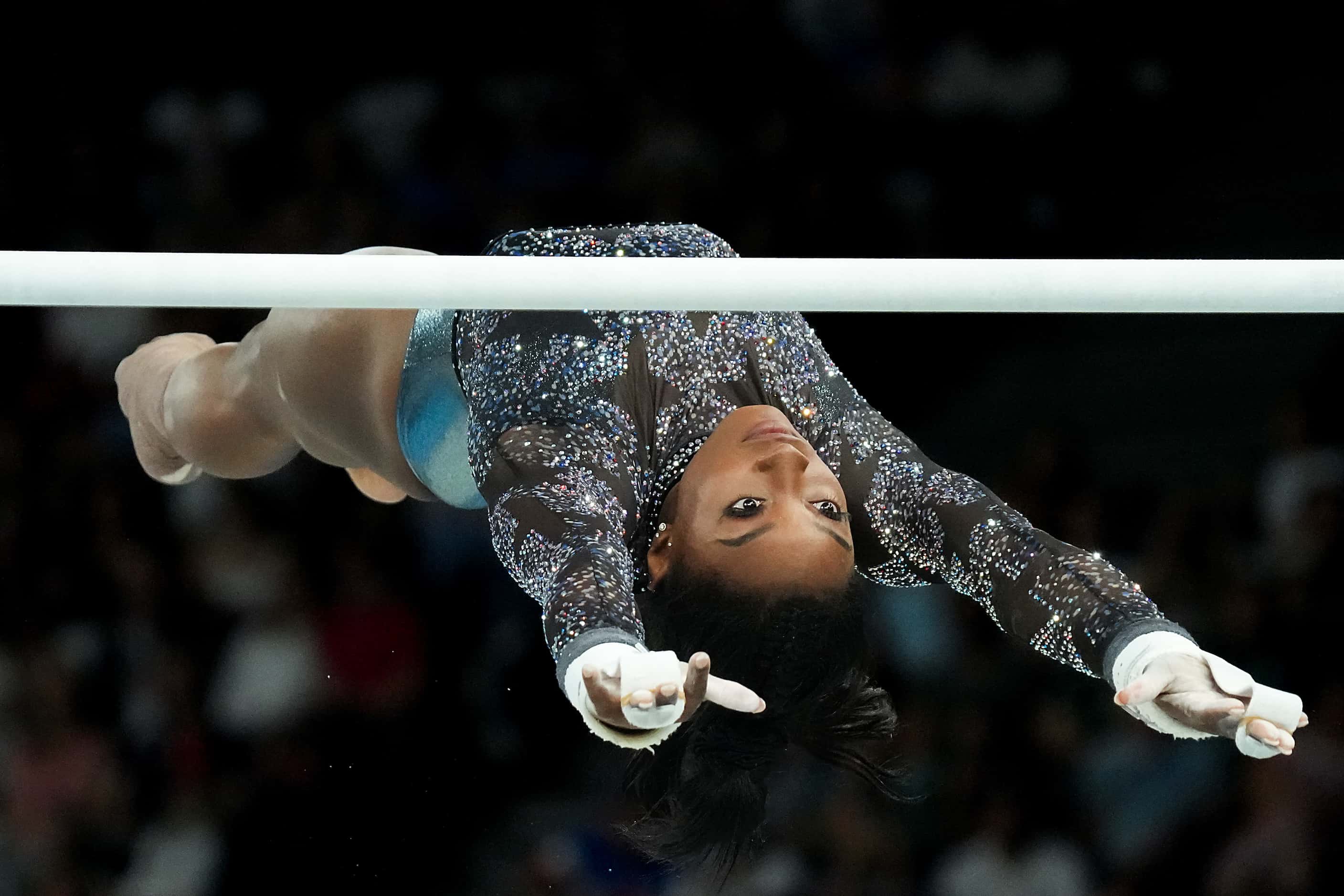 Simone Biles of the United States competes on the uneven bars during women’s gymnastics...