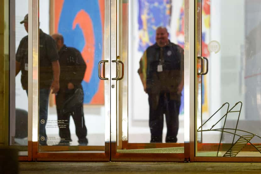 Broken glass lies at the entrance to the DMA on Wednesday night. Police said the suspect...