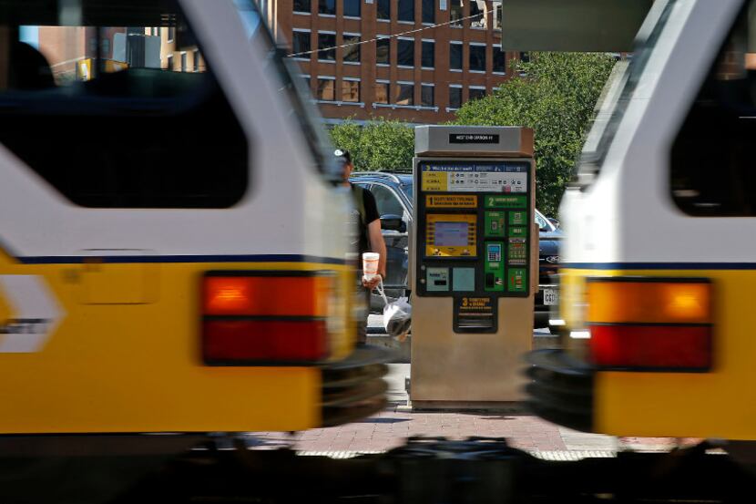 A ticket machine is seen as a DART train enters the West End Station in Dallas, Wednesday,...