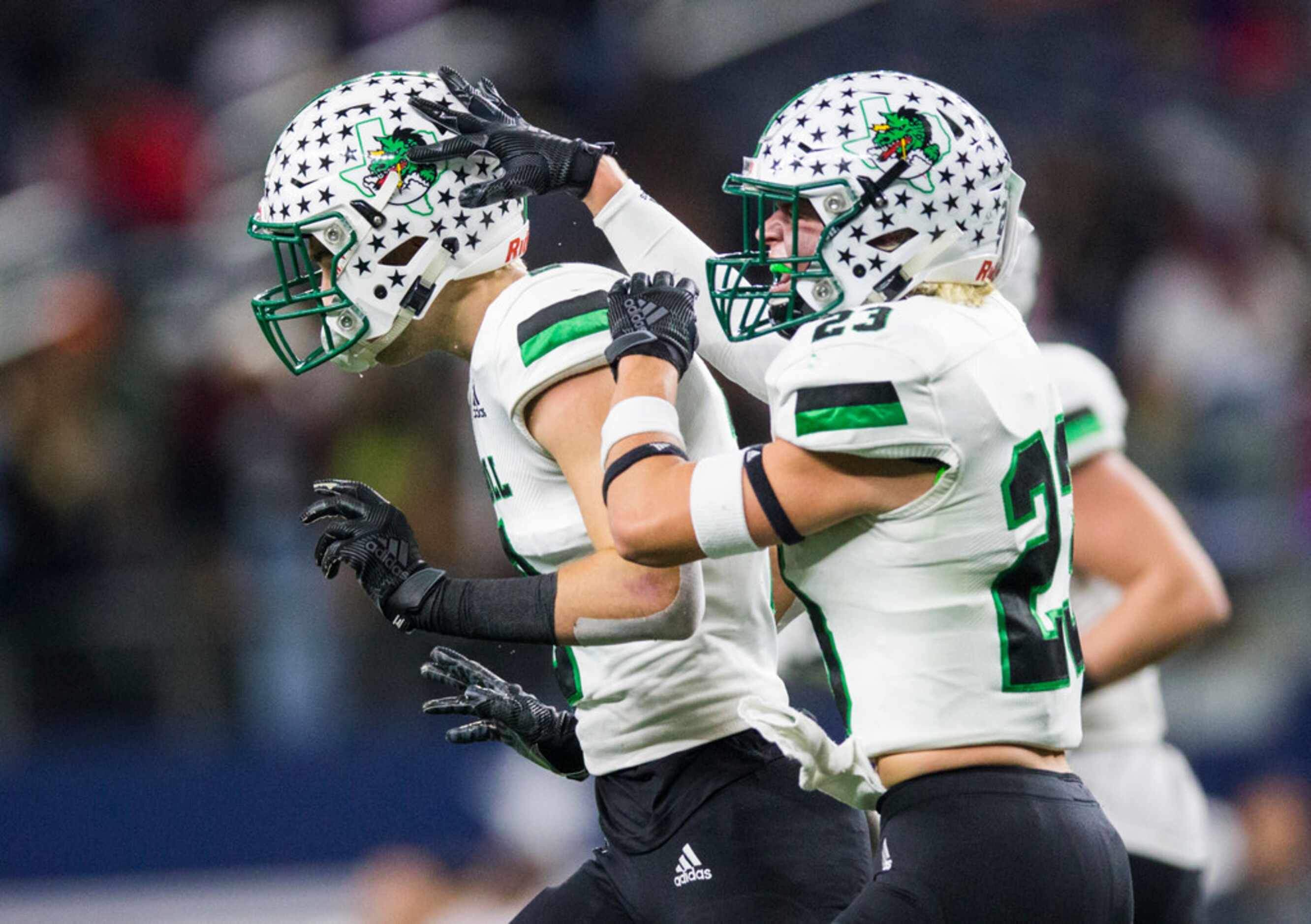 Southlake Carroll defensive back Dylan Thomas (2) celebrates an interception with defensive...