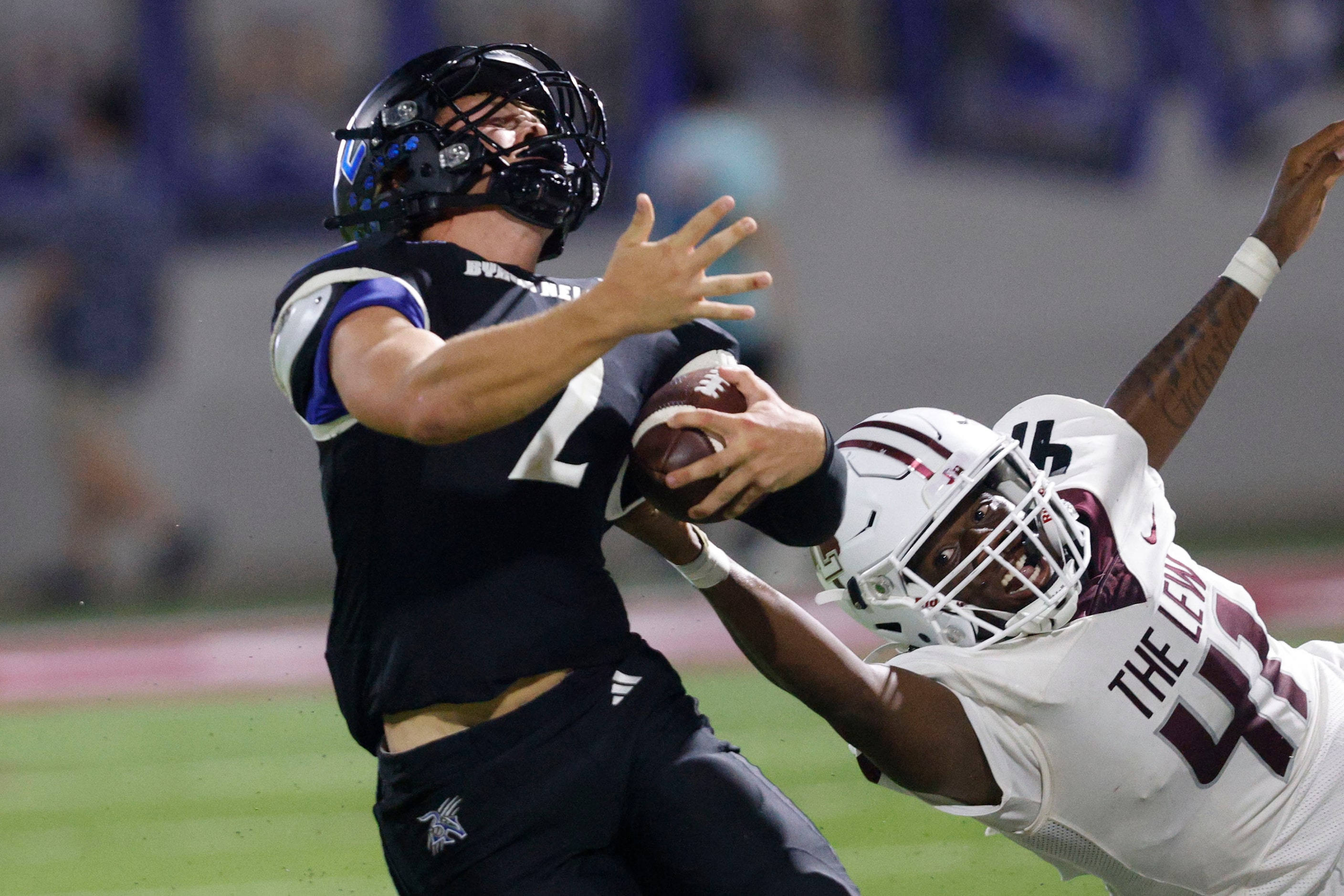 Byron Nelson's Grant Bizjack (2) is tackled by Lewisville's Gabe Webb during the second half...