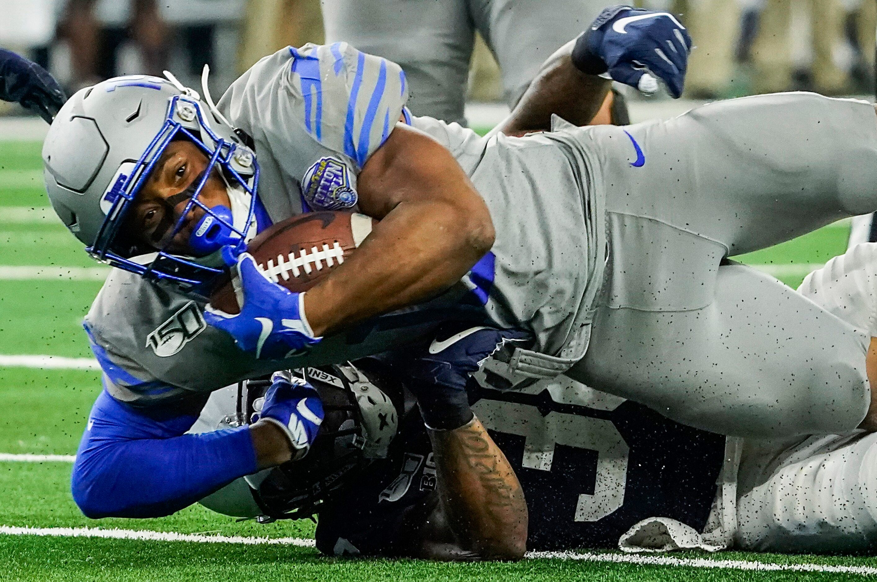 Memphis running back Kenneth Gainwell (19) is brought down by Penn State safety Lamont Wade...