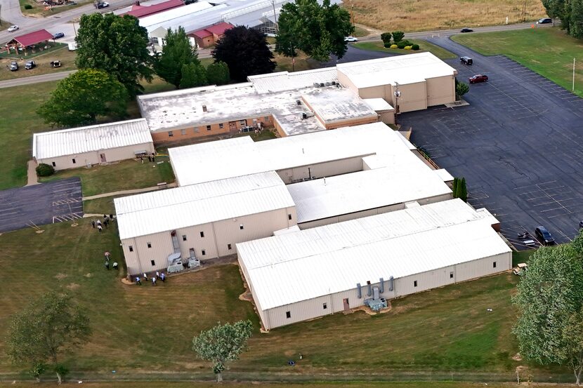 The roof of one of the buildings that are adjacent to The Butler Farm Show are where Thomas...