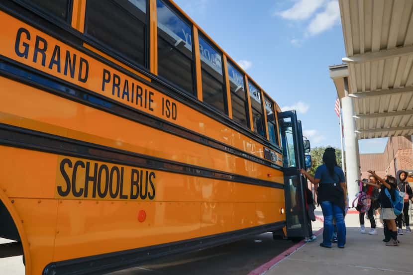 Elementary students load the bus outside Grand Prairie ISD’s Sam Rayburn Elementary STEAM...
