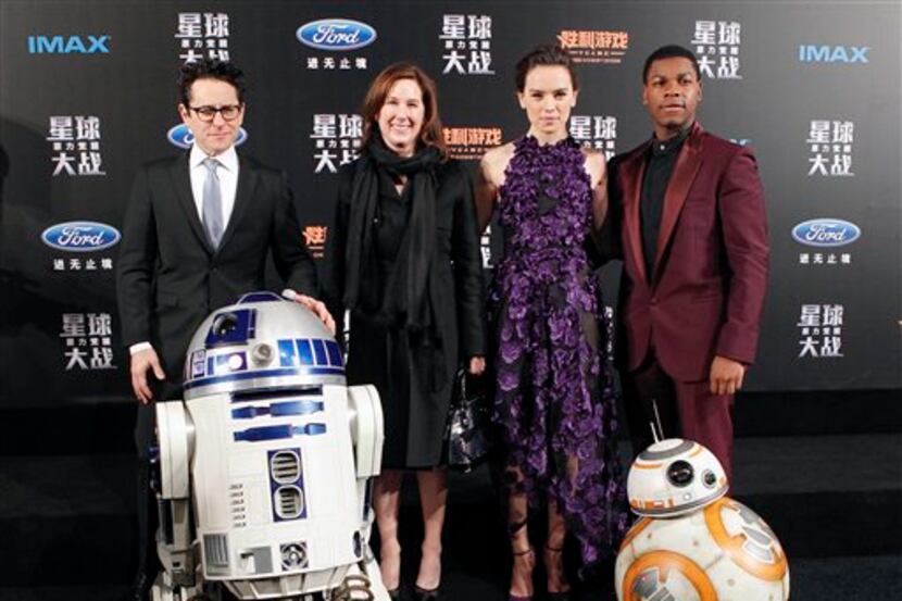 From left, director J.J. Abrams, producer Kathleen Kennedy, actress Daisy Ridley and actor...