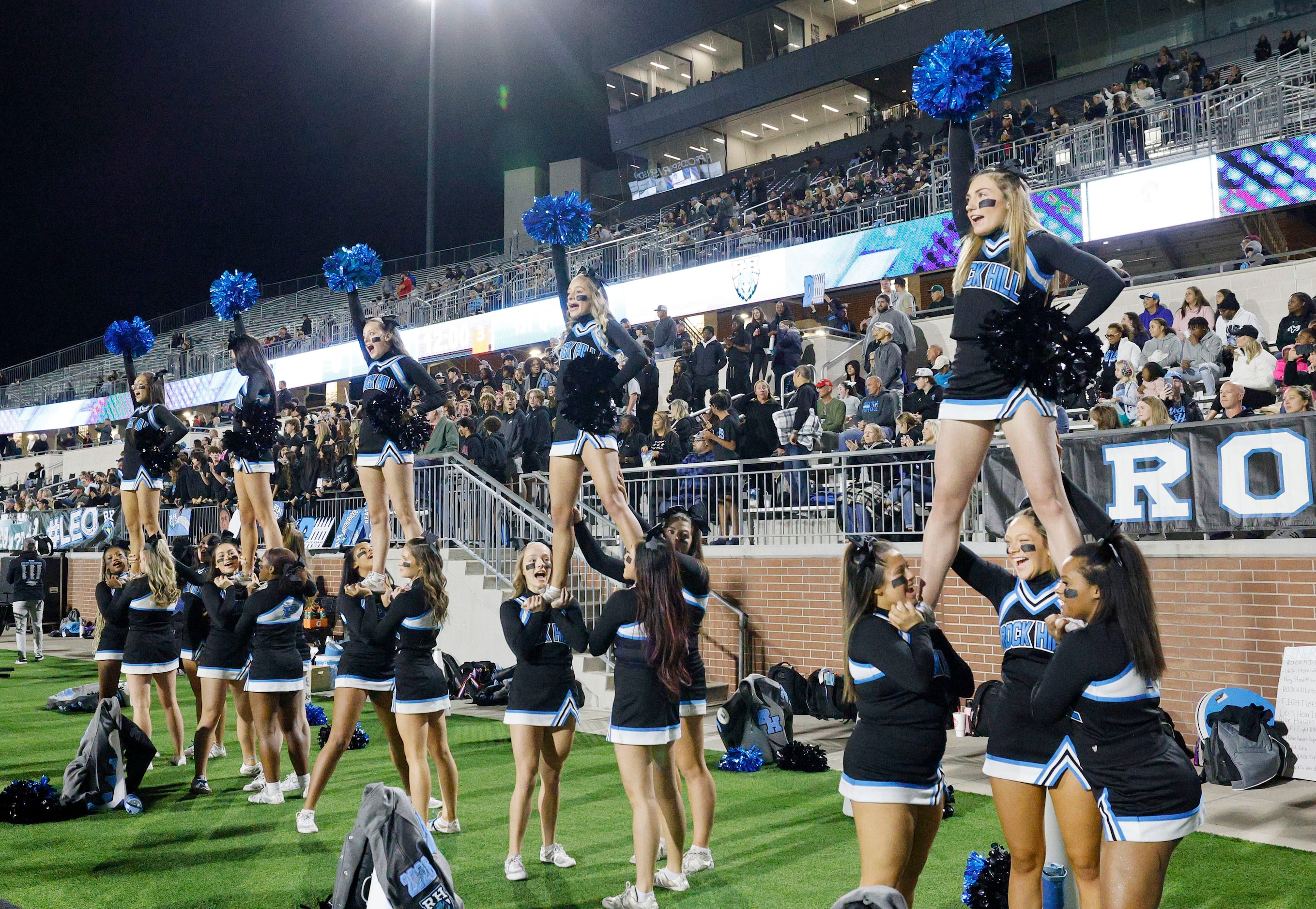 Rock Hill’s cheerleaders perform during a high school football game against Hebron at...