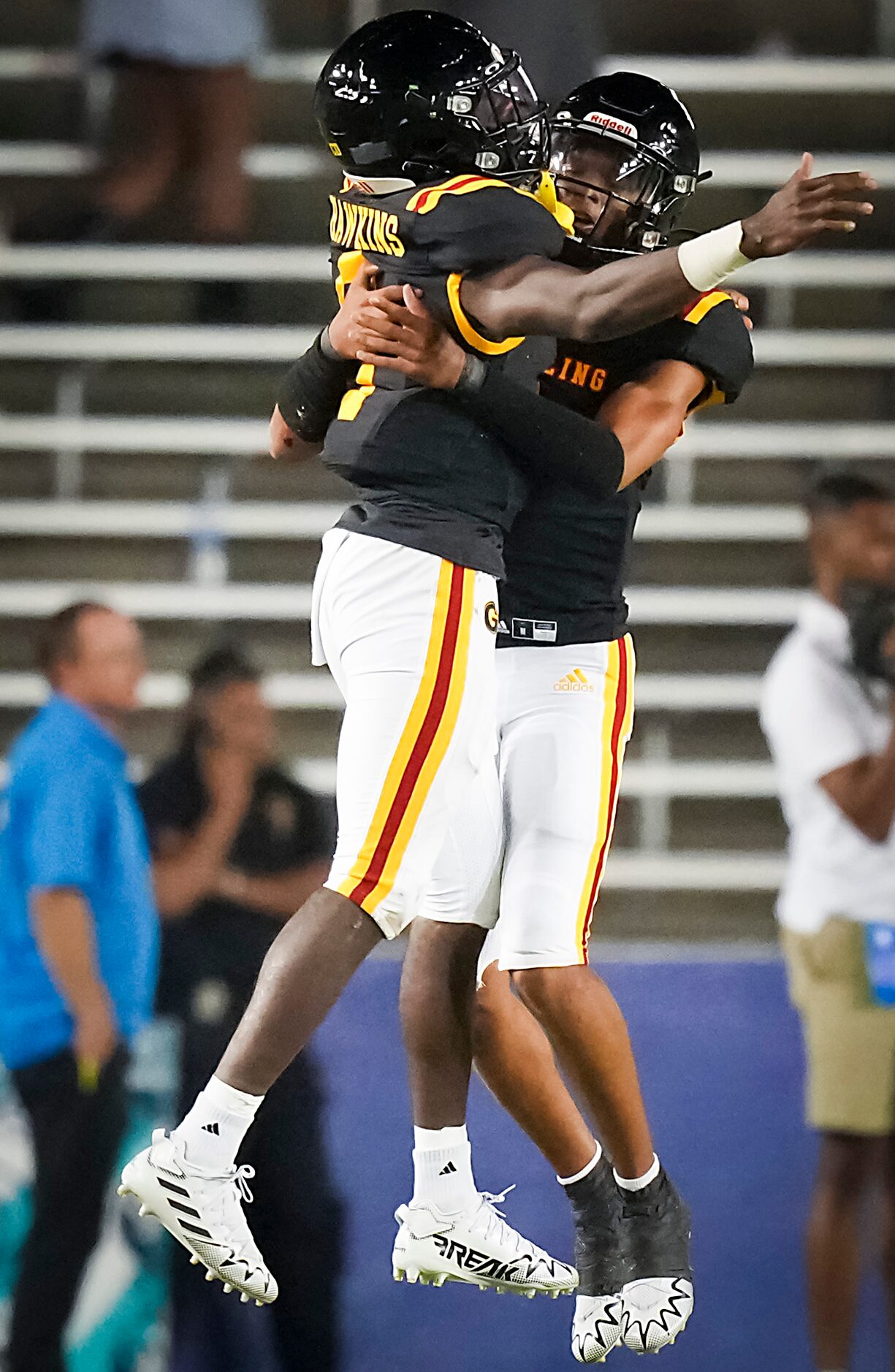 Grambling quarterback Julian Calvez (4) celebrates with teammate Quaterius Hawkins after...