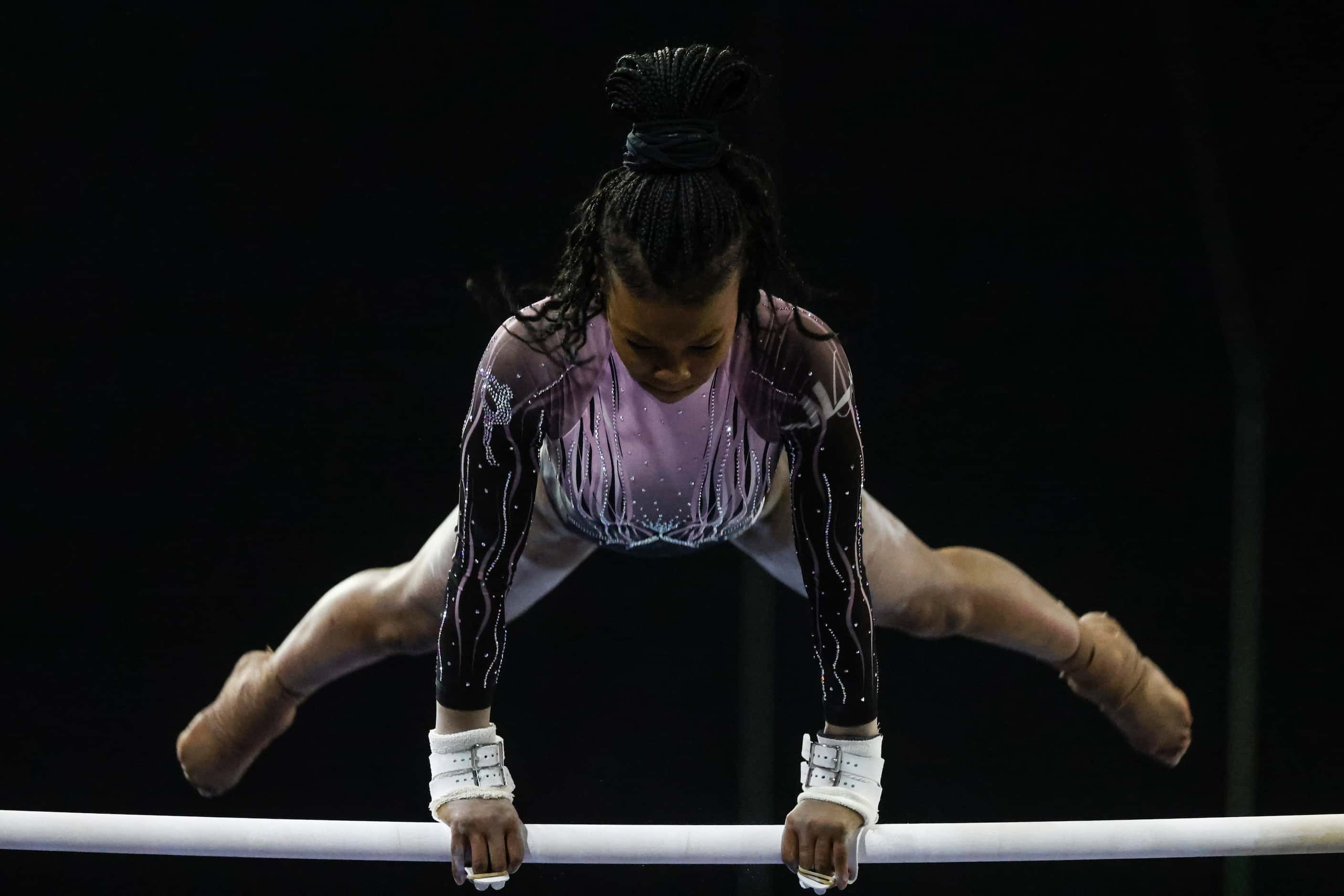 Jamison Sears of World Class Gymnastics, Yorktown, Virginia competes in uneven parallel bars...