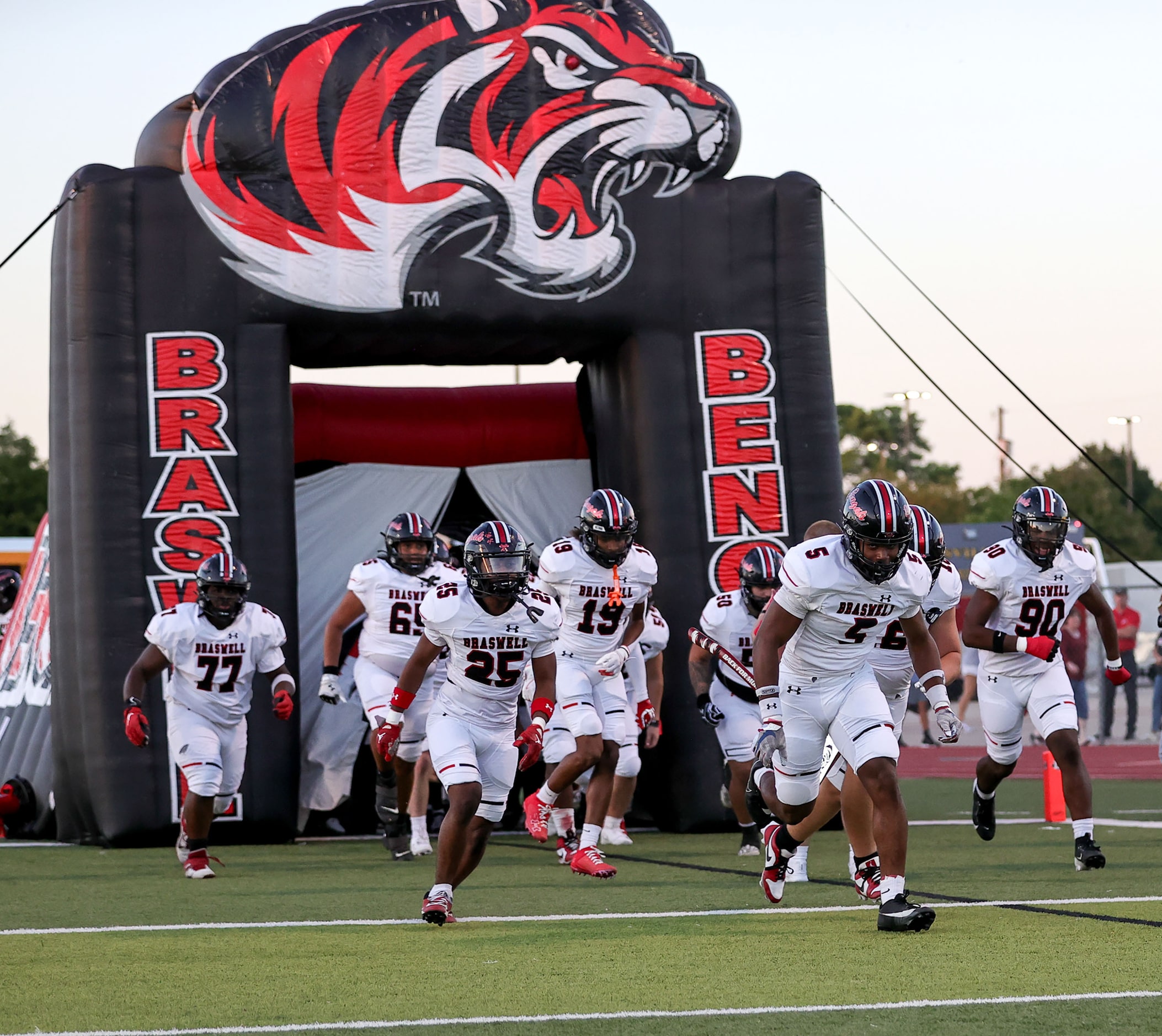 The Denton Braswell Bengals enters the field to face Lewisville in a District 5-6A high...