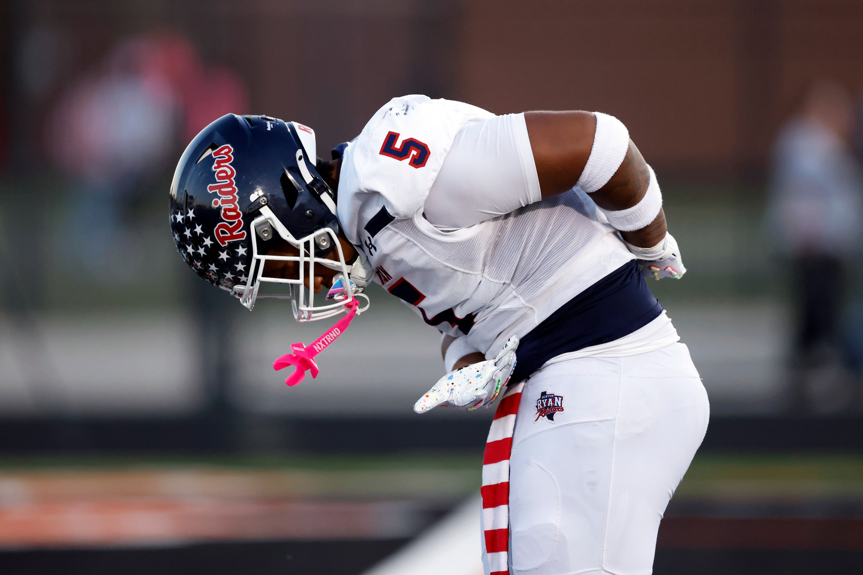 Denton Ryan’s Uzziah Warmate (5) takes a bow after running for a 53 yard touchdown when he...