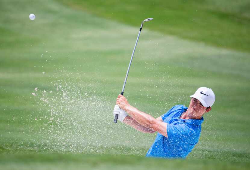 Cody Gribble hits a ball out of the sand on hole two during round 1 of the AT&T Byron Nelson...