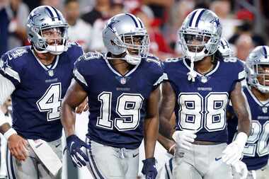 Dallas Cowboys quarterback Dak Prescott (4) and wide receiver CeeDee Lamb (88) congratulate...