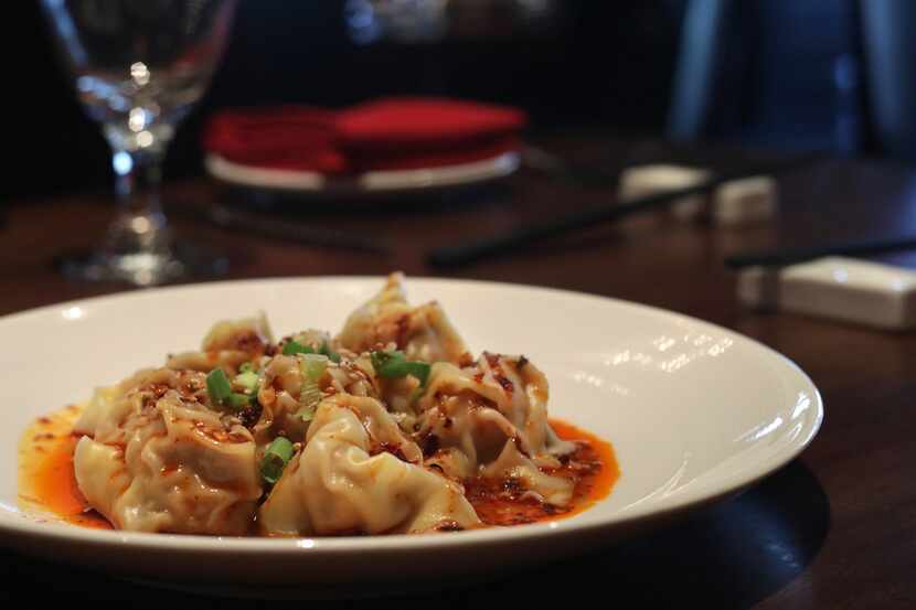 Pork wontons in Szechuan chile sauce are one of co-owner Jia Huang's favorite dishes at her...