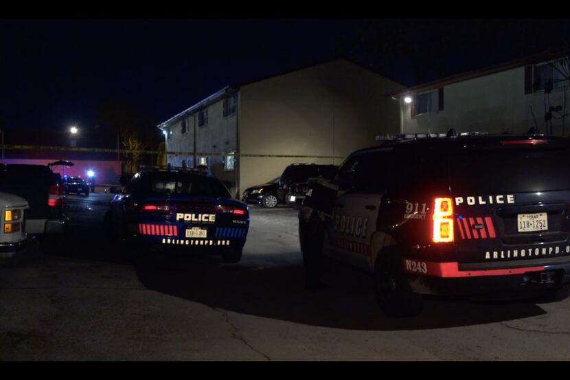 Arlington police gather at an apartment complex where an explosion occurred late Friday....
