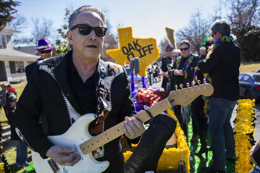
Grand Marshal Jimmie Vaughan played on a float during the annual Oak Cliff Mardi Gras...