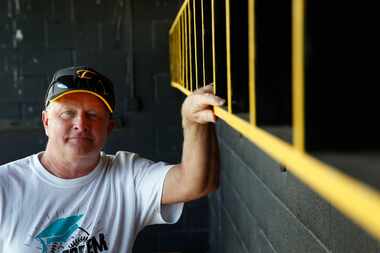 Forney softball coach Pat Eitel poses for a portrait in the dugout of Forney High School's...