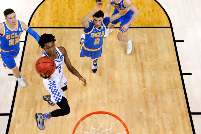 

MEMPHIS, TN - MARCH 24: De'Aaron Fox #0 of the Kentucky Wildcats drives to the basket...