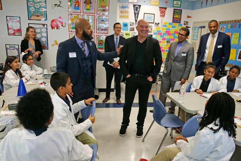 Andre Agassi, co-managing partner for Turner-Agassi Charter School Facilities Fund, (center)...