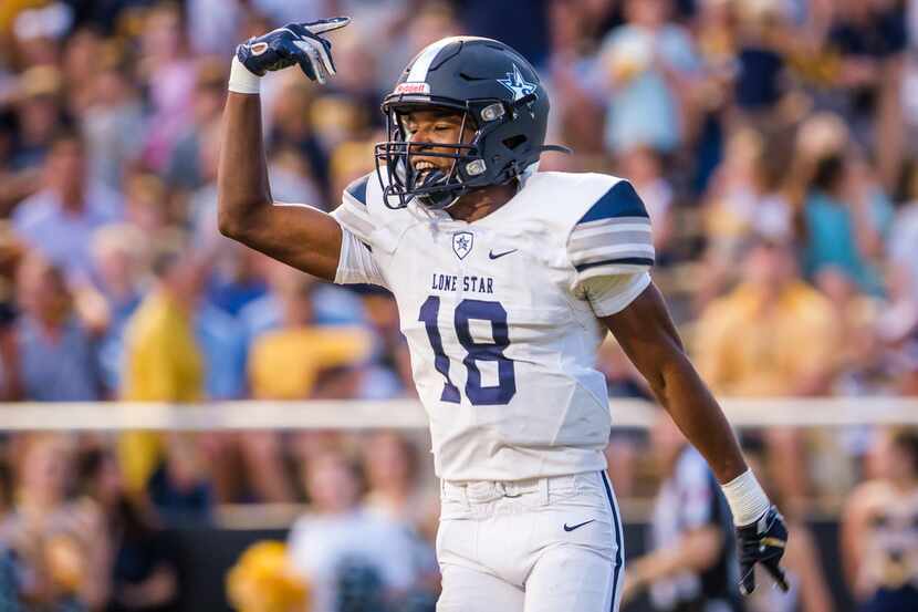 Frisco Lone Star wide receiver Marvin Mims celebrates after scoring on a touchdown reception...