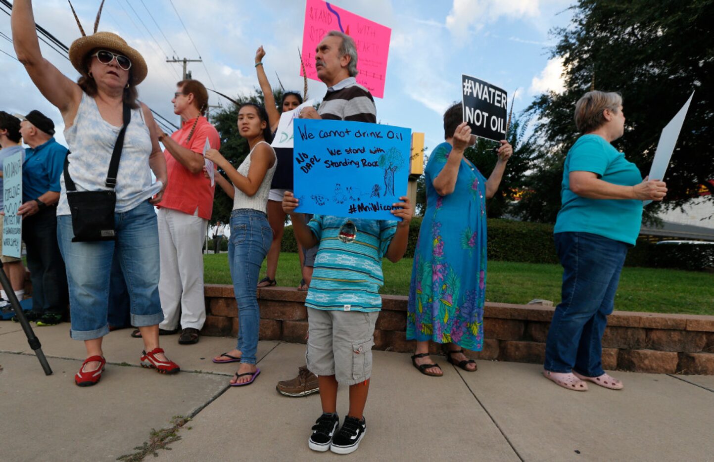 Maddox Soto, 5, holds a protest sign with other protesters on the National Day of Action...