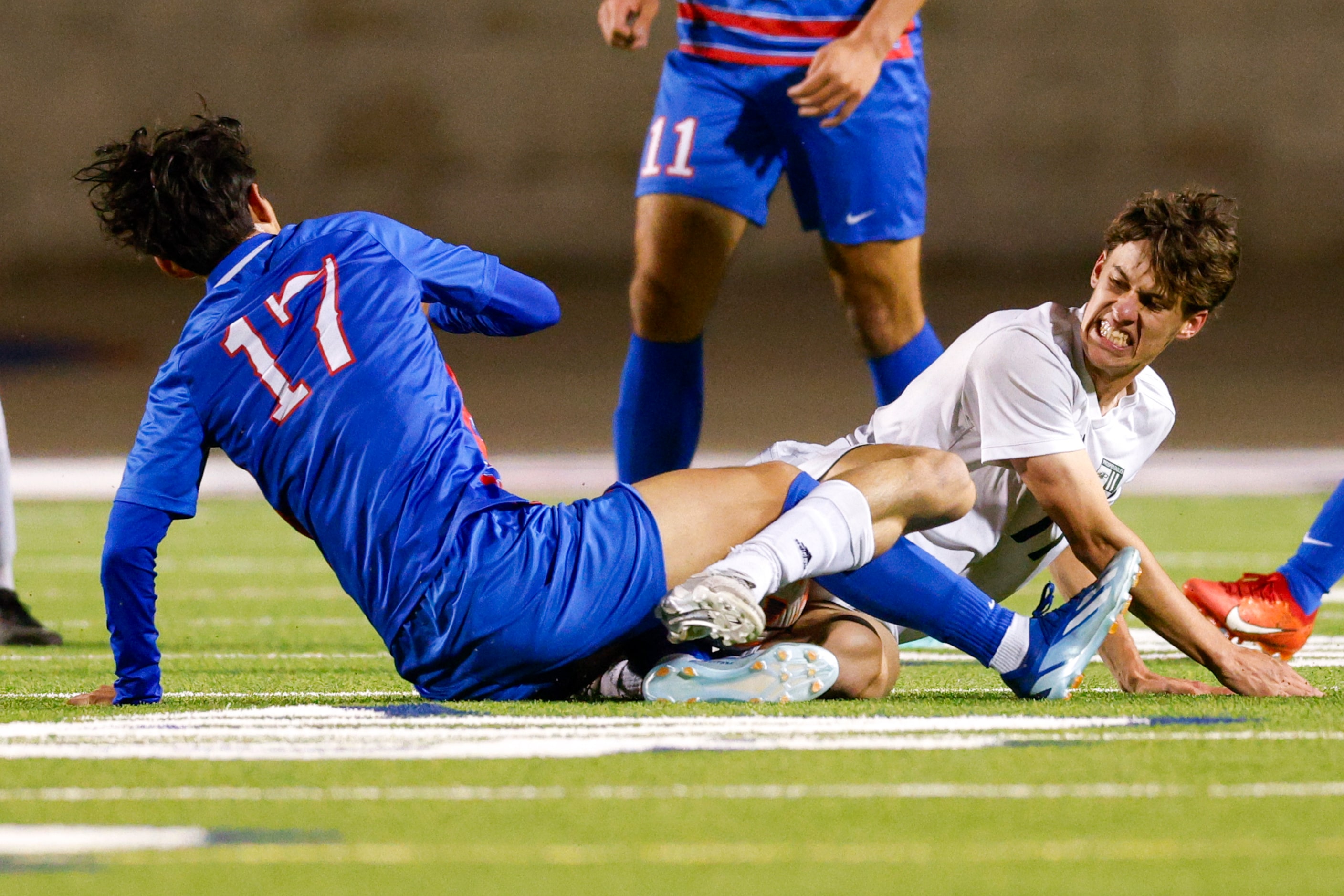 Allen’s Giancarlo Ramirez (17) and Prosper’s Tate Jones (right) slide into each other as...