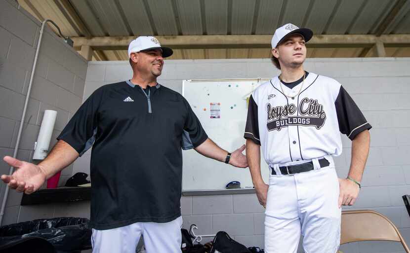 Gavin Lynch, 18, right, talks with head coach Clay Wolfe before a high school baseball game...