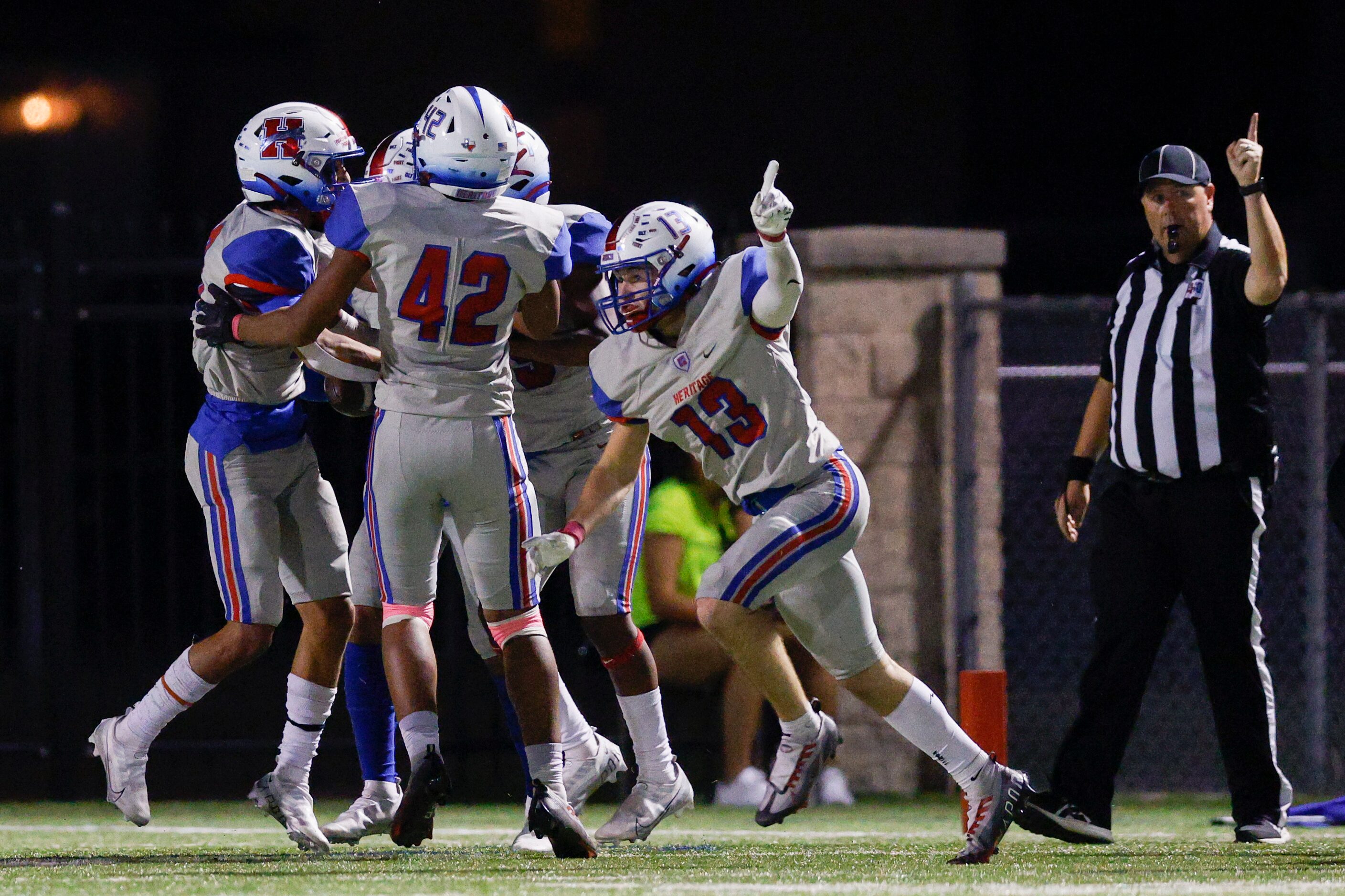 Midlothian Heritage defensive back Ryan Sattehite (13) celebrates a fumble recovery...