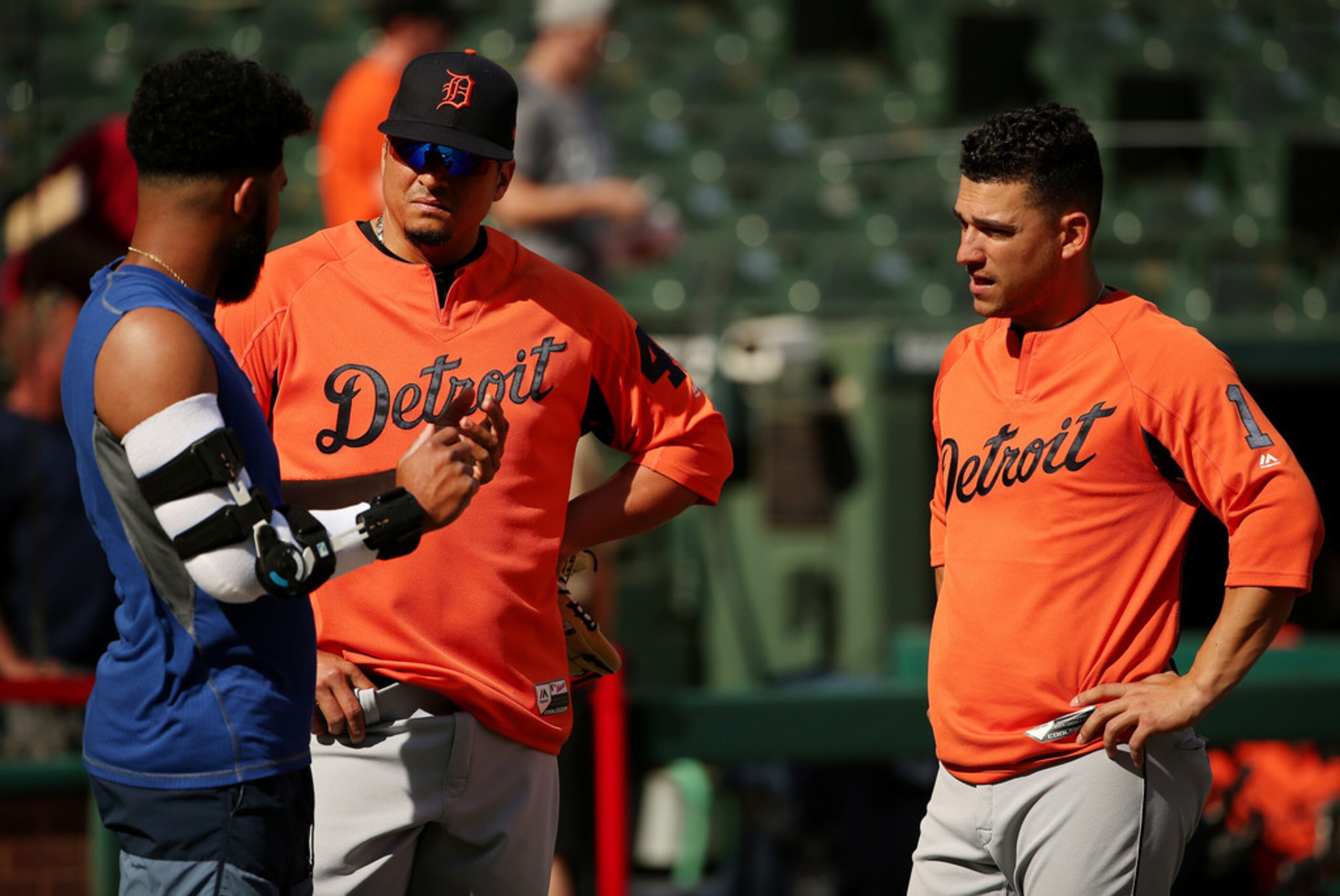 Texas Rangers shortstop Elvis Andrus (1) talks to Detroit Tigers designated hitter Victor...