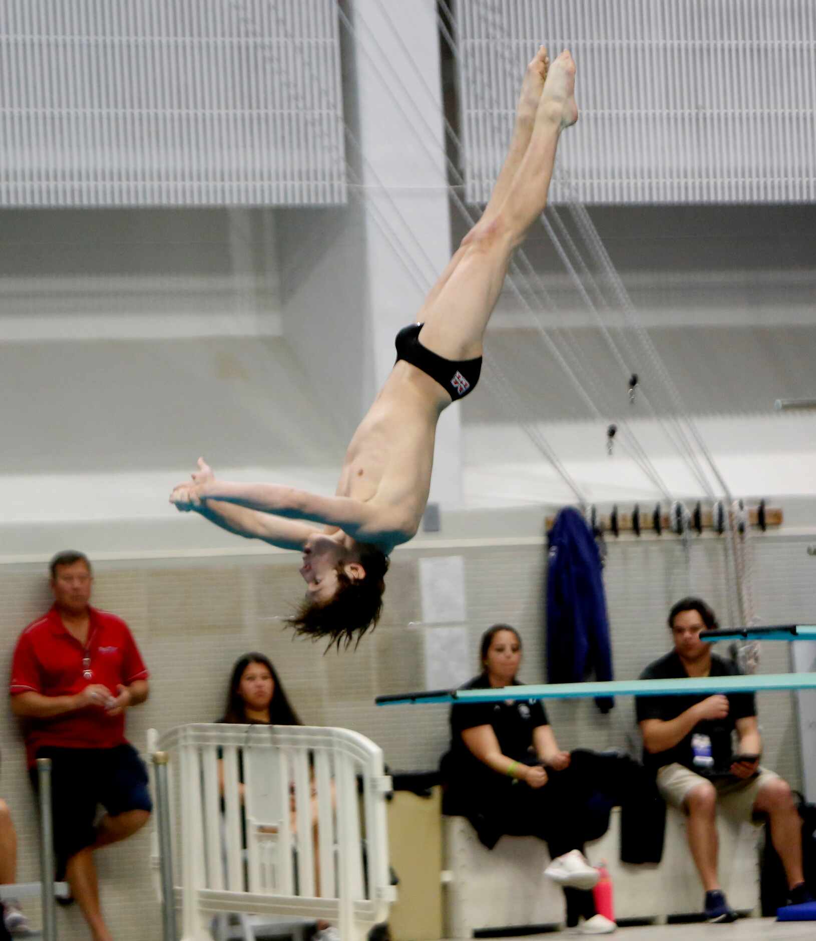 Flower Mound Marcus diver Nolan Chennault performs during the 6A Boys Diving competition....