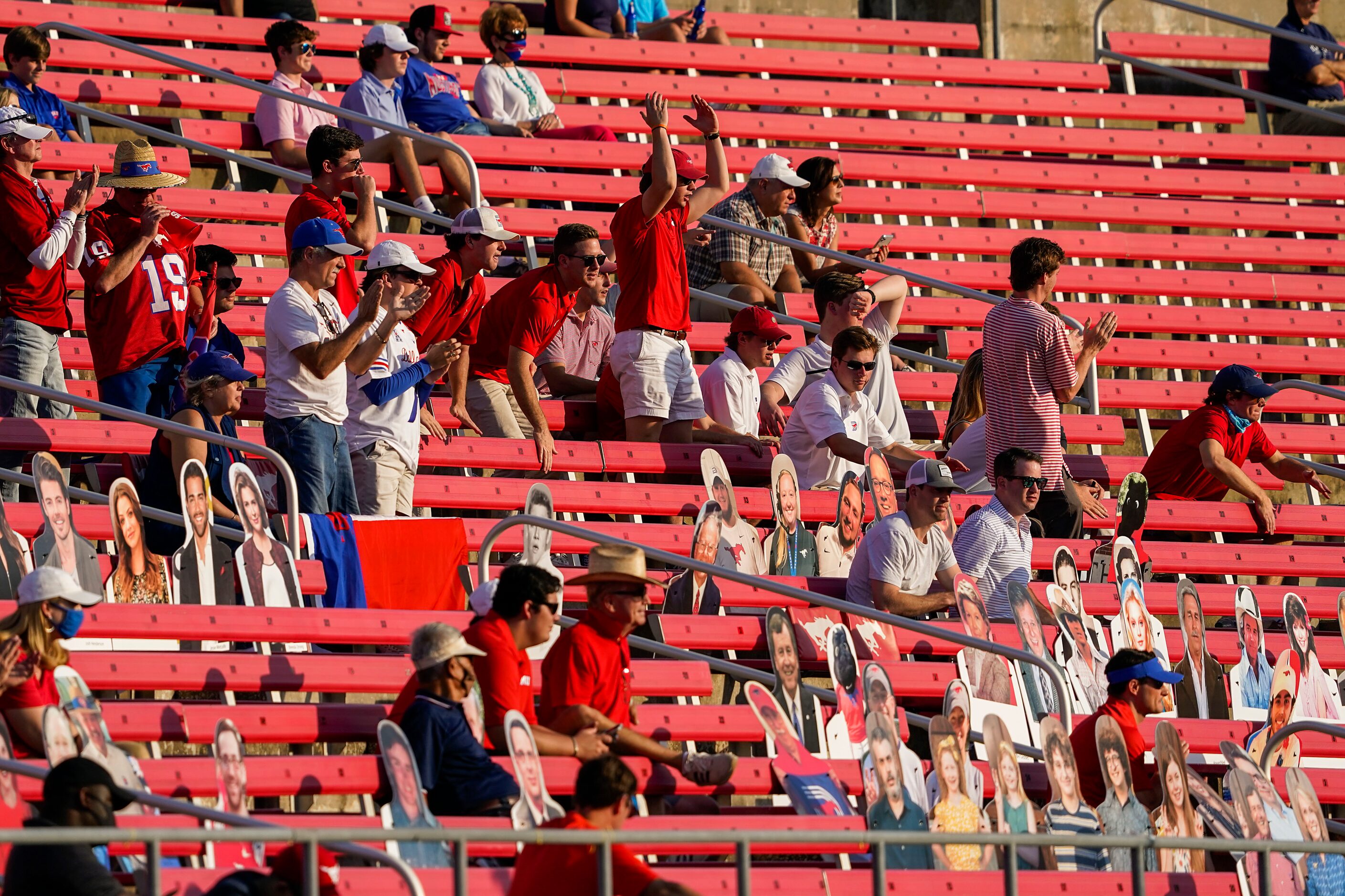 SMU fans cheer their defense during the second half of an NCAA football game against Memphis...