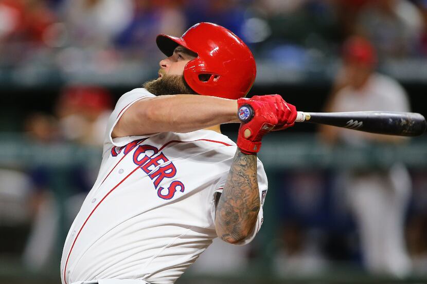 ARLINGTON, TX - AUGUST 12: Mike Napoli #5 of the Texas Rangers in the fourth inning hits a...