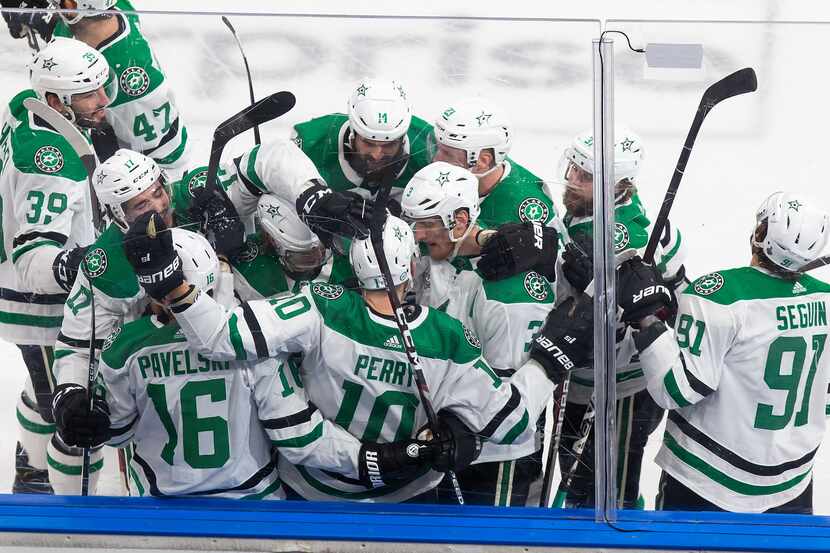 The Dallas Stars celebrate Corey Perry's game winning goal against the Tampa Bay Lightning...