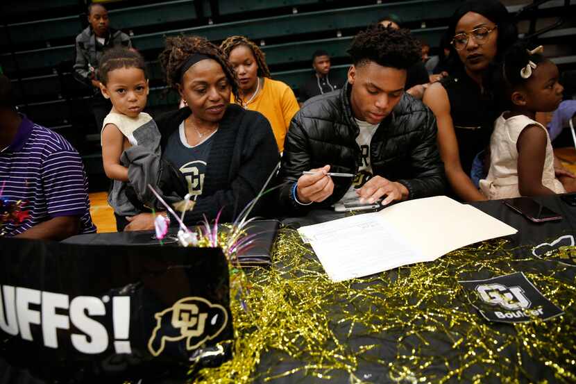 Wide receiver La'Vontae Shenault signs with Colorado alongside his mother, Annie Shenault...
