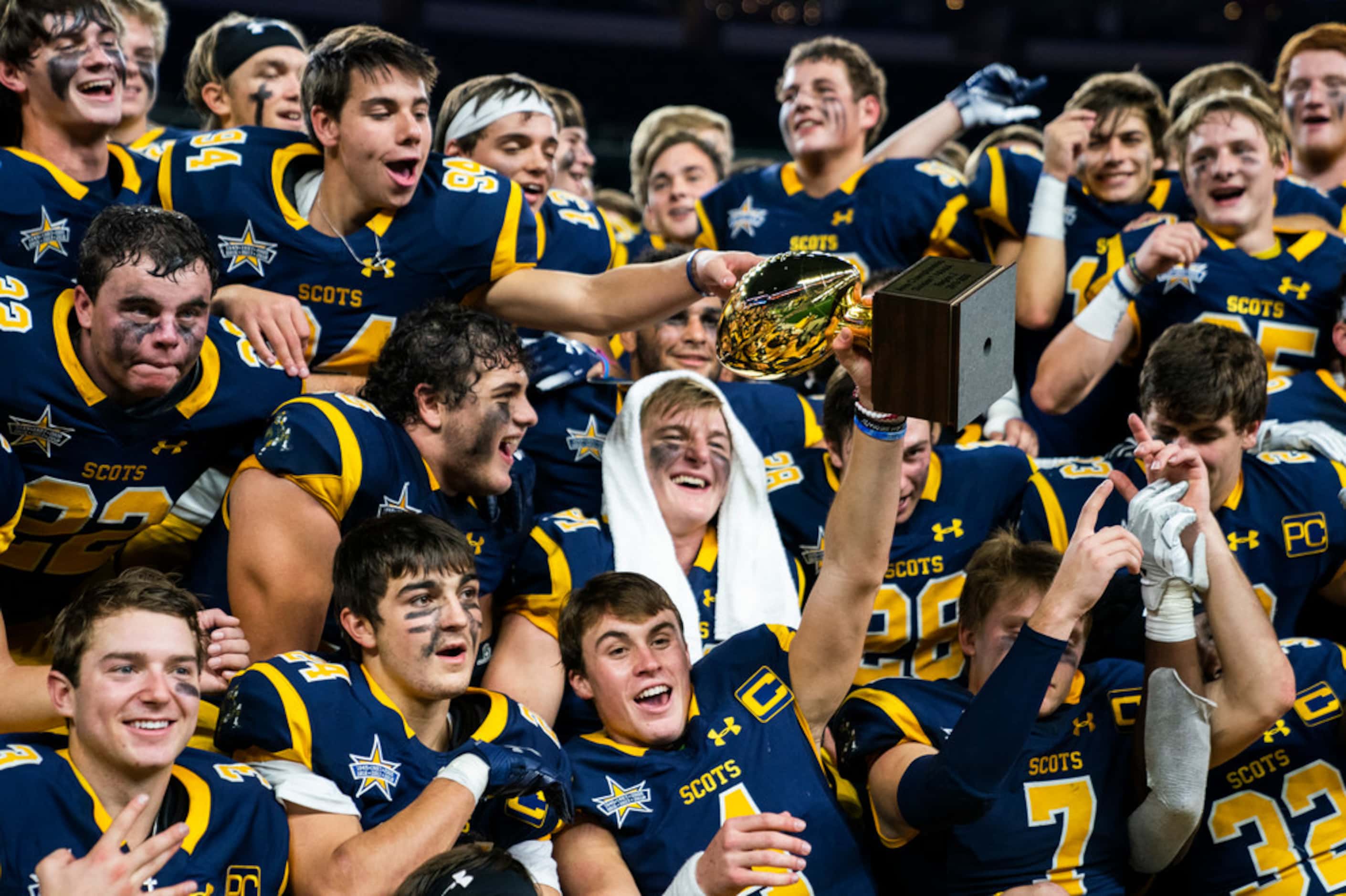 Highland Park football players celebrate a 63-28 win over Magnolia in a Class 5A Division I...
