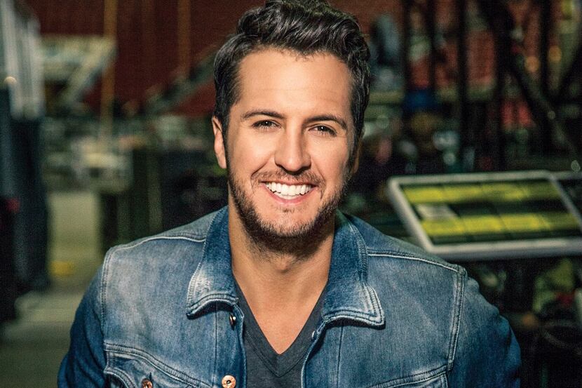 Luke Bryan may have a hit with "Strip it Down," but that's the opposite of what he's doing...