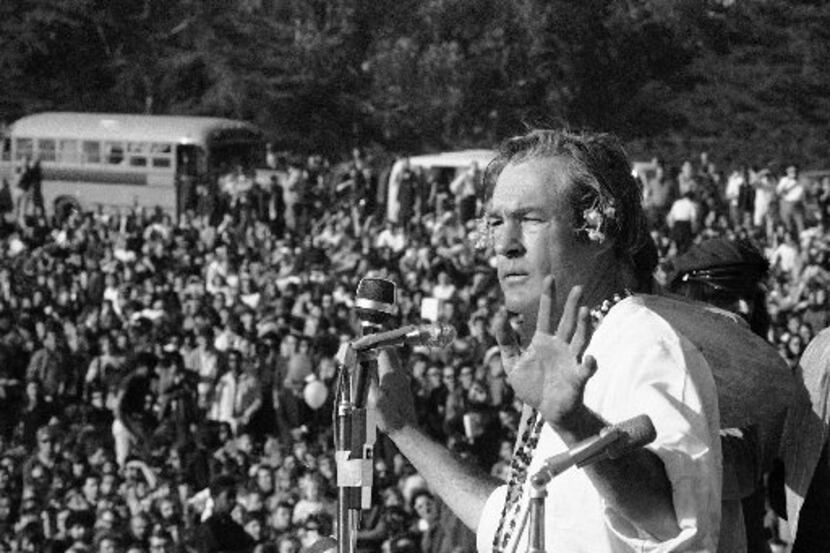  Timothy Leary addresses a crowd of hippies at the "Human Be-In" that he helped organize in...