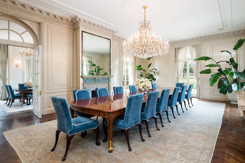 This elegant dining room conveys the grandeur and scale of the home's rooms.