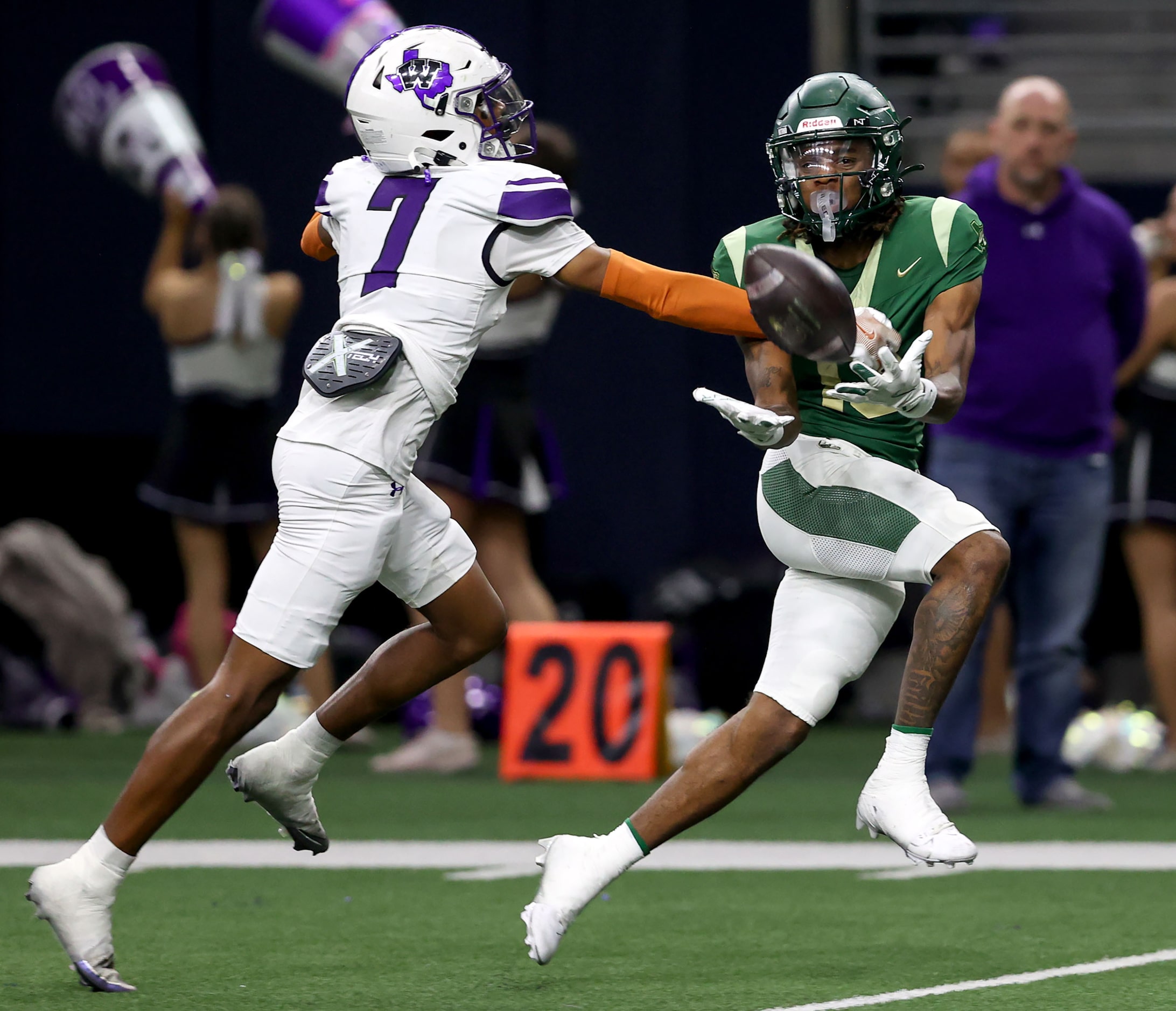 DeSoto wide receiver Daylon Singleton (right) comes up wth a touchdown reception against...