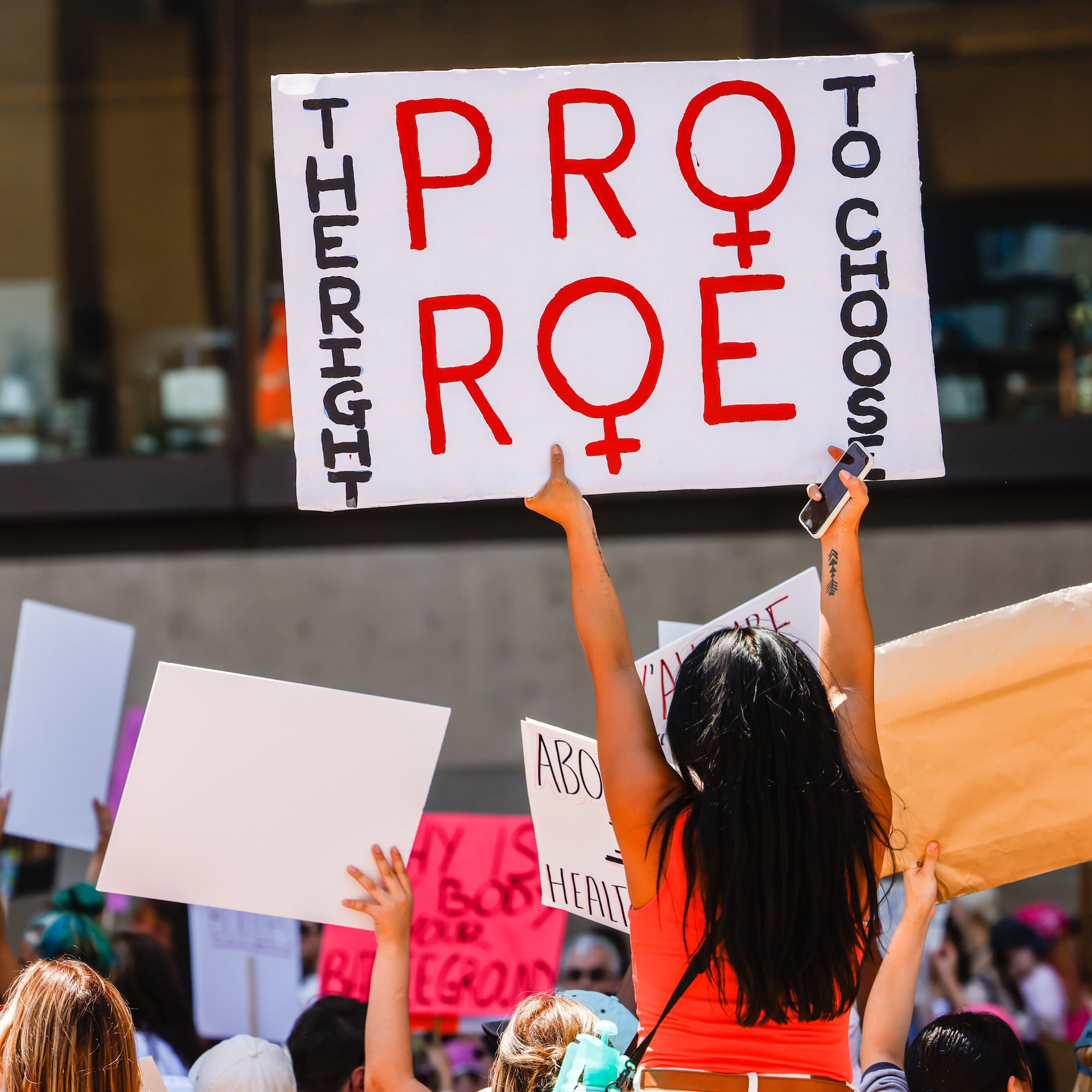 Abortion rights supporters gather at the Dallas City Hall in downtown Dallas on Wednesday,...