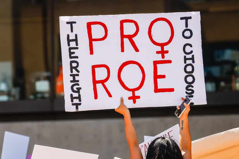 Abortion rights supporters gather at the Dallas City Hall in downtown Dallas on Wednesday,...